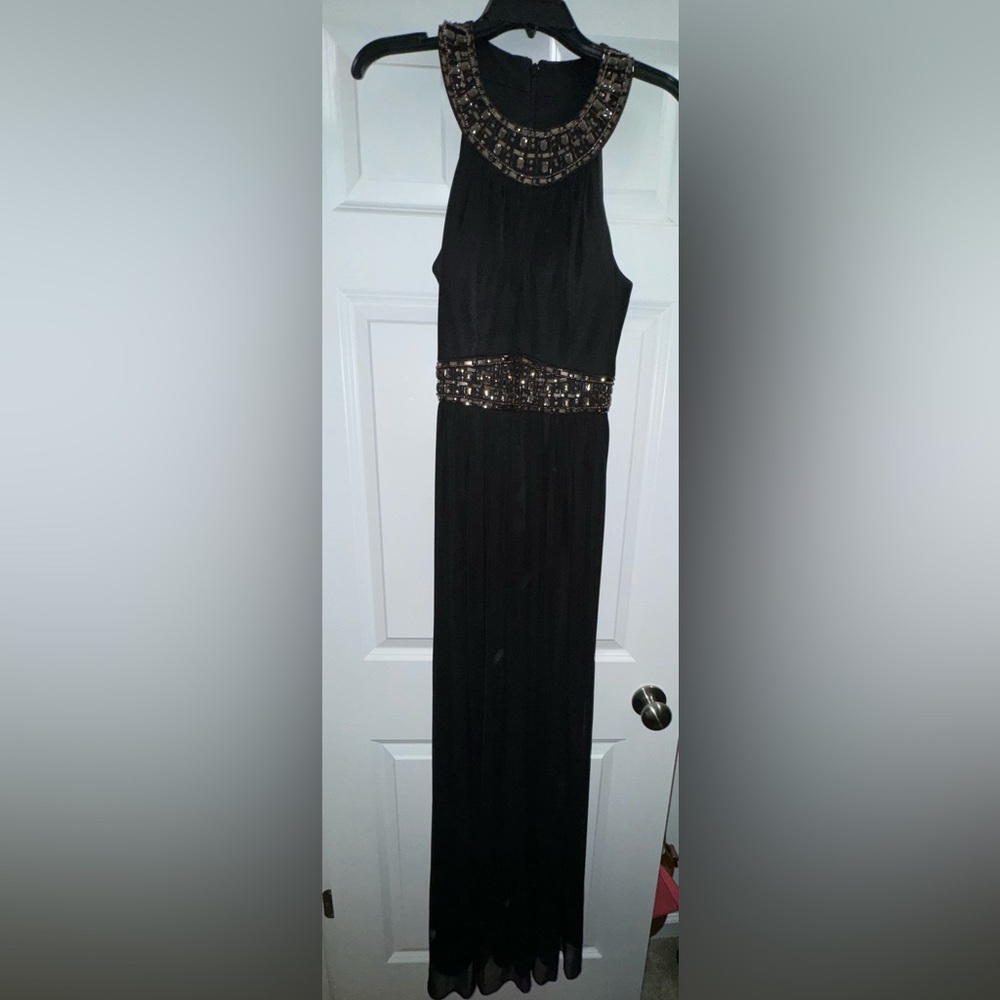 Black long formal dress with beaded detail.